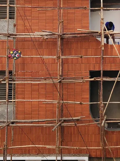 A look at the 'Kutumb' project during construction. This image shows the beauty of the process, with the curved brick facade taking shape. For me, the craftsmanship and the materials themselves are a core part of the architectural story.