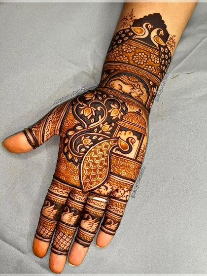 A very dense and intricate design featuring multiple peacocks, a lantern, and other traditional motifs. The use of negative space makes the figures pop.