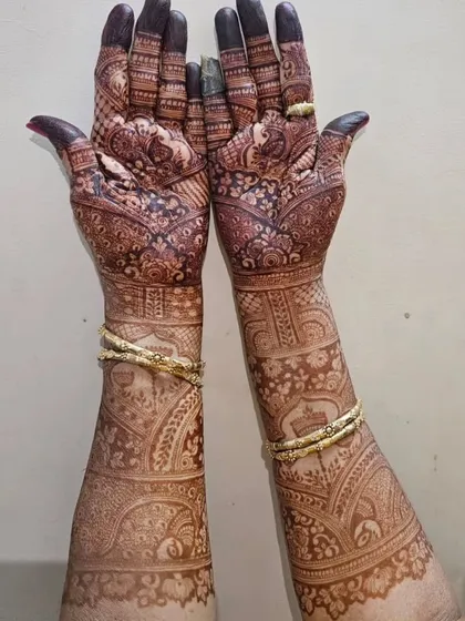 This is the kind of rich, dark stain you can expect from my henna. This full-arm bridal design has developed into a beautiful deep brown color.