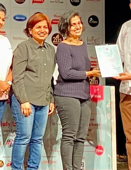A proud moment, accepting my award. I am so grateful for the platform to showcase my work.
