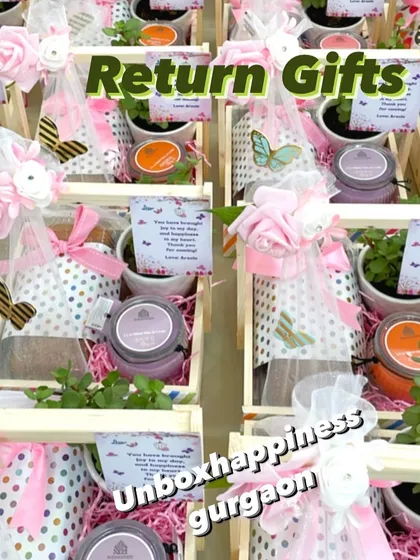 An overhead view of the colorful butterfly-themed return gifts, showing the variety of scented candles included.