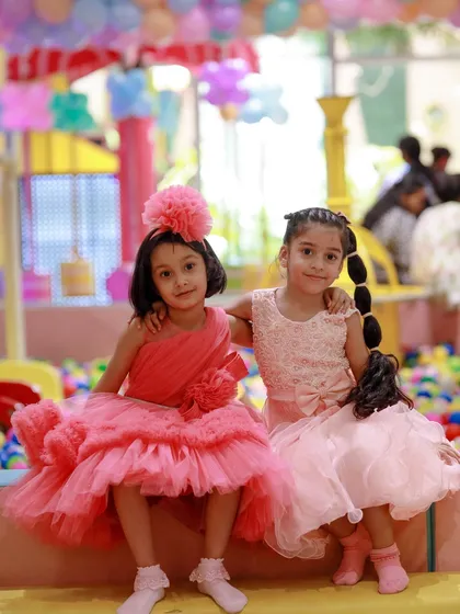 Best friends forever at a unicorn-themed birthday bash. The edge of our ball pit makes for a perfect photo spot.