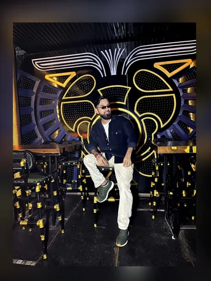 A stylish shot of me at the venue before a gig. The ambiance of the club is a huge part of the overall experience.