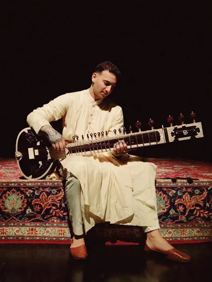 A candid shot from my time in London, sitar in hand. Even my off-stage style is a blend of comfort and artistic expression.