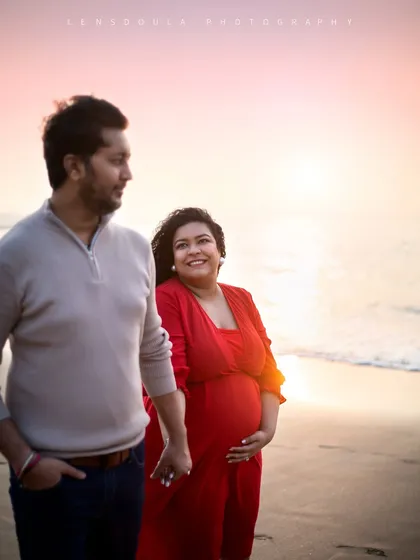 A candid moment during a sunset walk on the beach. The warm light and natural interaction make this photo feel so genuine.