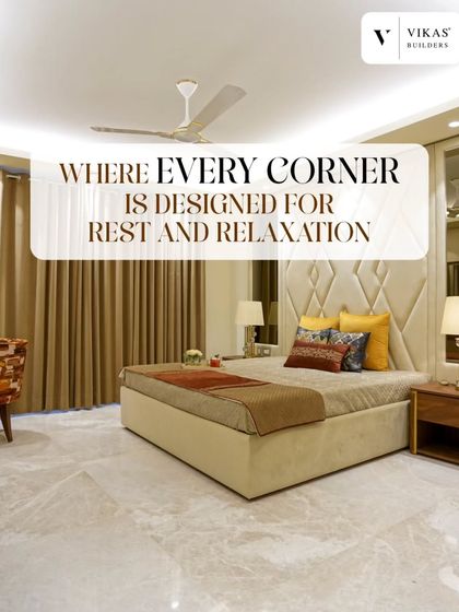 We design every corner for rest and relaxation. This bedroom showcases a plush, upholstered bed with a diamond patterned headboard, complemented by warm lighting and soft textiles.