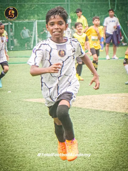 The determination on a player's face as he sprints during a game. We build champions through hustle and hard work.