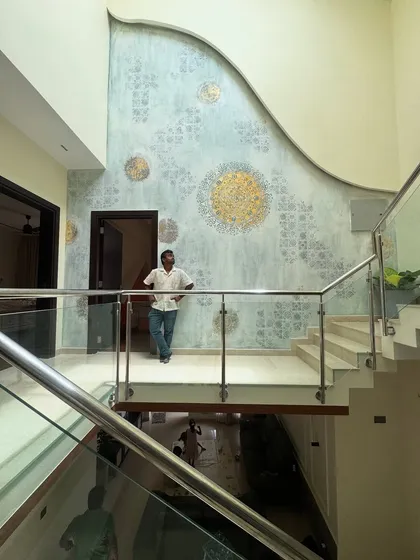 Standing proud in front of this magnificent, double-height wall. The client approved the design on the spot, and pulling off this design was a surprise I gave to myself!
