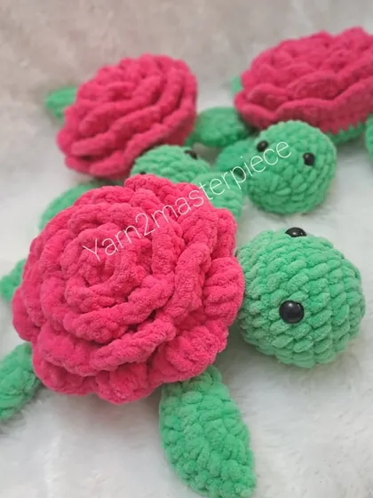 Another view of the rose turtles, showing their cute little faces peeking out from under their floral shells.