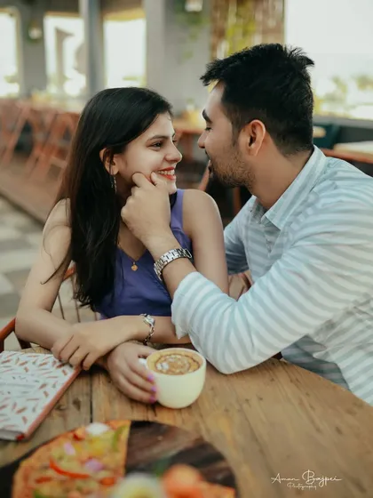 A beautiful close-up capturing a playful and affectionate moment. His gentle touch and her bright smile tell a story of love and happiness.