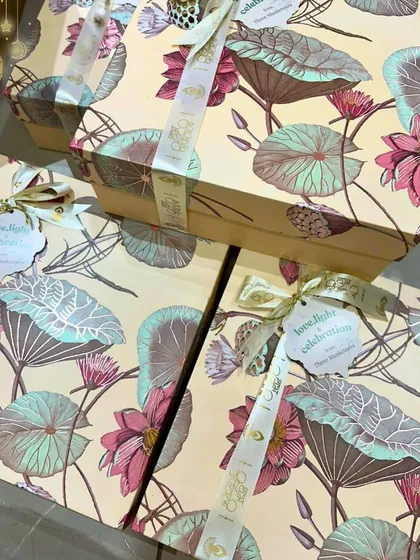 The packaging is just as important as what's inside. These beautiful lotus-print boxes were chosen for a special Diwali order, adding an extra layer of artistry and elegance to the gift.