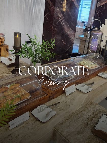 A sleek and professional setup for a corporate event. We provided a clean and elegant display of sandwiches and other light bites, perfect for a business meeting or conference.