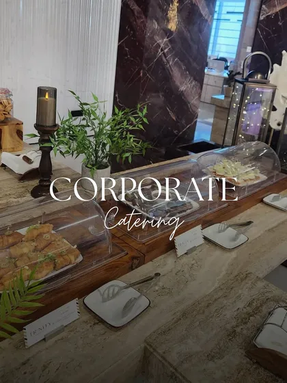 A sleek and professional setup for a corporate event. We provided a clean and elegant display of sandwiches and other light bites, perfect for a business meeting or conference.