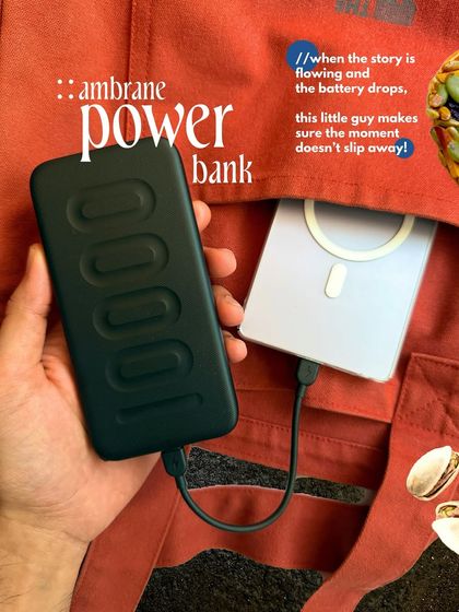 A product-focused shot of an Ambrane power bank, styled within my tote bag. This demonstrates a direct yet creative approach to showcasing a product's utility in a real-world context.