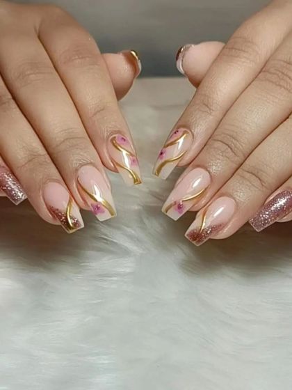 A duplicate image showing the full set of the nude, rose gold, and floral nail art.