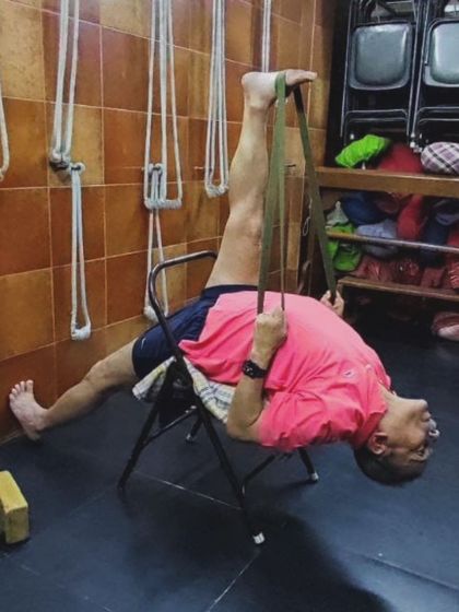 A supported leg stretch with a chair.