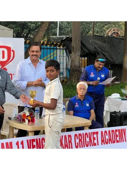 Darshan Rathod receiving his Man of the Match award for a league game performance.