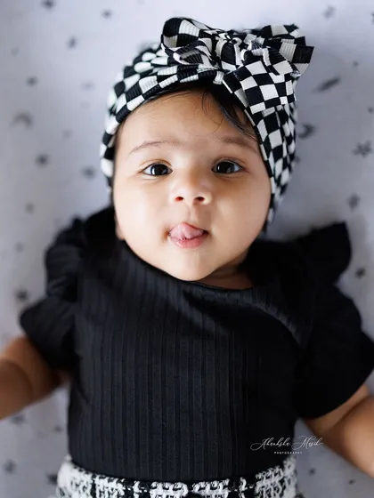 A little bit of playful personality. That tiny tongue-out expression is an adorable, fleeting moment that I am so glad I could capture for this family to cherish.