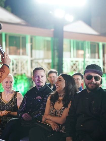 Taking the mic into the crowd is one of the best ways to make an event interactive. Here I am at a wedding sangeet, engaging with guests and making them part of the celebration.