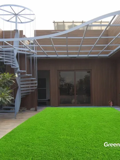 The magic of a terrace transformation. We installed an open pergola, WPC wall paneling, and a vibrant green artificial lawn to completely redefine the look and feel of this expansive outdoor space.