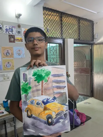 A vintage yellow ambassador car painted in watercolor. This student worked on capturing the car's form and the urban setting.