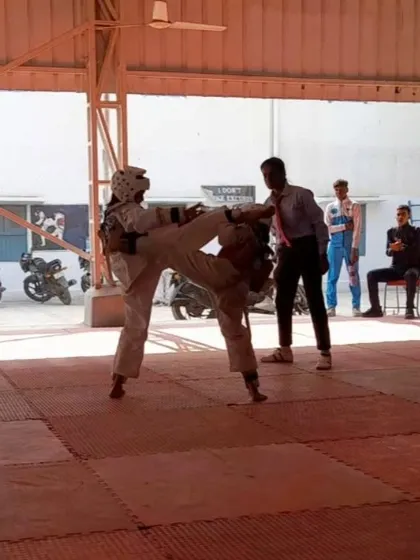 Rachna Kumari lands a clean kick during a competitive match. This perfectly timed shot captures the essence of kyorugi: speed, power, and accuracy.