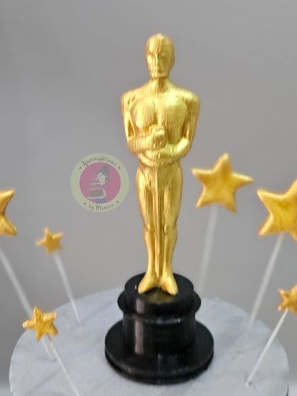 A close-up of our 3D-printed and hand-painted Oscar trophy.