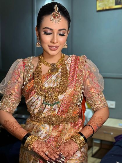 A serene, eyes-closed portrait showcasing the soft, blended eyeshadow and the overall elegance of the bridal look.