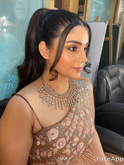 This is another angle of the chic party makeup, showing how the look holds up from different views. The contouring is soft, and the highlight gives a beautiful glow to the skin.