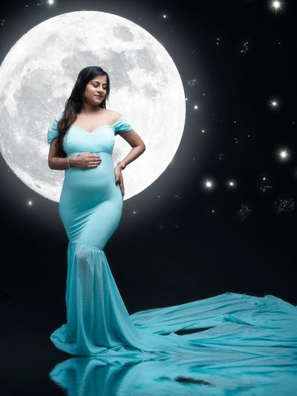 Celestial magic. This enchanting maternity shot, with the moon and stars, shows the beauty of motherhood shining brighter than ever.