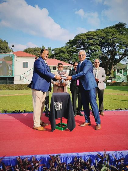 Presenting the T.B. Hanumantharaj Memorial Trophy.