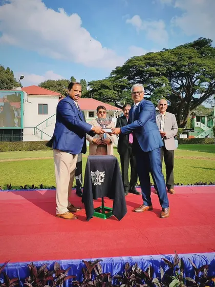 Presenting the T.B. Hanumantharaj Memorial Trophy.