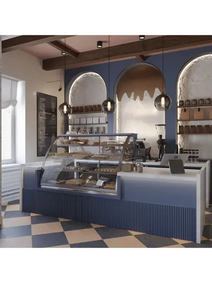 The service counter features a navy blue fluted base and a clean white top, set against arched niches. The design is both stylish and practical for a busy cafe environment.