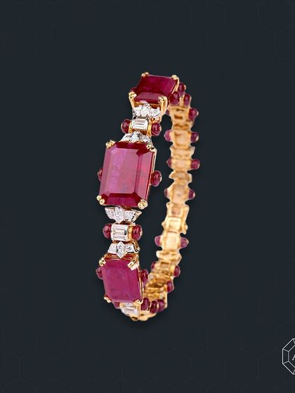 This ruby bangle blends the fiery passion of red gemstones with a sleek, sophisticated design, effortlessly elevating any ensemble.