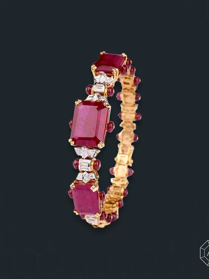 This ruby bangle blends the fiery passion of red gemstones with a sleek, sophisticated design, effortlessly elevating any ensemble.