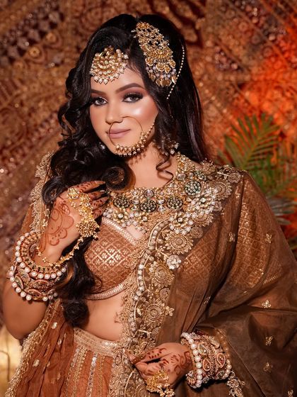 This shot highlights the beautiful curly hairstyle and detailed makeup of the Arabic bride. I teach a combination of hair and makeup skills so my students can offer a complete package.
