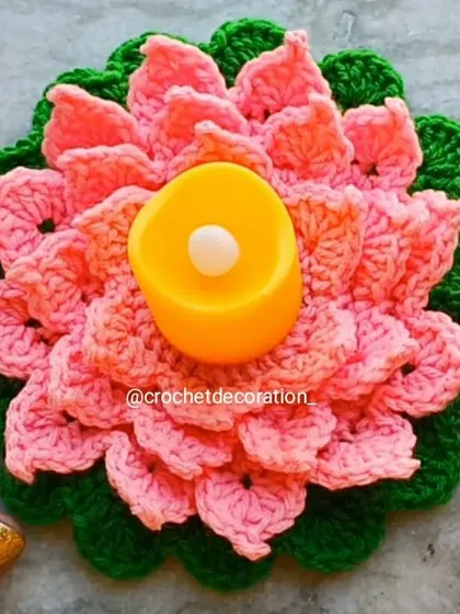 Our handmade crochet lotus diya holder, designed with layers of pink and green petals to resemble a blooming lotus. It's a beautiful and reusable decoration for Diwali, pujas, or to create a festive ambiance in your home.