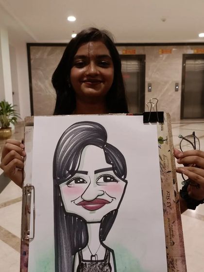 A student from Symbiosis Medical College with her caricature. College events are always full of life.