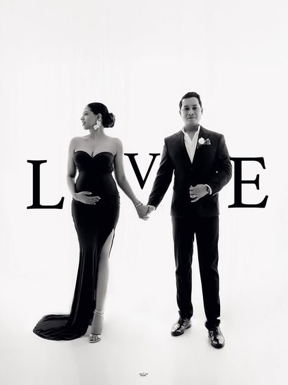 A creative shot that spells out the love. This is a fun way to add a personal touch to your maternity couple's photoshoot.