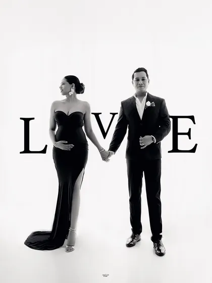 A creative shot that spells out the love. This is a fun way to add a personal touch to your maternity couple's photoshoot.