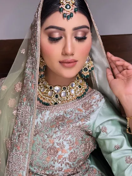 A detailed view of the soft, earthy-toned eye makeup for our Nikkah bride. This style enhances the eyes without overpowering her delicate features.