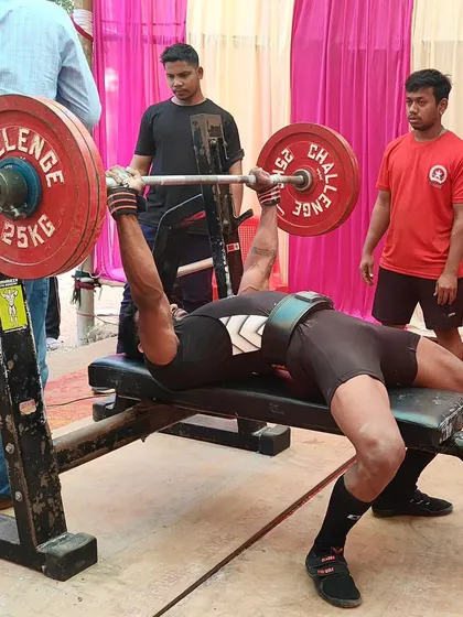 A lifter executing a bench press at the State Meet. A wounded tiger is a dangerous beast, and we come to every competition ready to fight.
