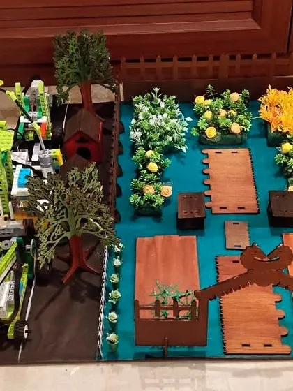 A smart garden project by the 'Tech Titans' team. This FLL Explorer project uses LEGO robotics and sensors to automate watering and care for a miniature garden.