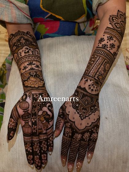 A design rich in traditional symbols, including a kalash (pot), swan, and palace architecture.