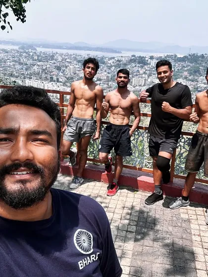 The physique of a conditioned fighter. This is the result of countless hours of dedicated strength training, conditioning, and disciplined nutrition. We build athletes who are as strong as they look.