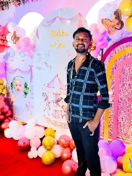 A look at one of our grandest setups, a carousel-themed first birthday party. The vibrant pink and yellow balloon decor fills the space, creating a magical atmosphere for the celebration.