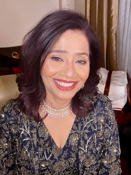 A beautiful, warm smile from the mother of the groom.