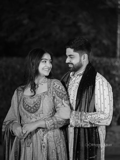 A timeless black and white shot from our Mata Ki Chowki. The contrast in our outfit textures, his simple fabric against my detailed embroidery, creates a visually interesting and balanced photo.