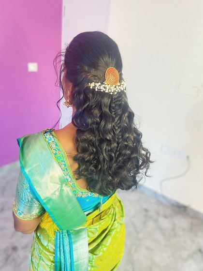 A side view of the beautiful curly hairstyle.