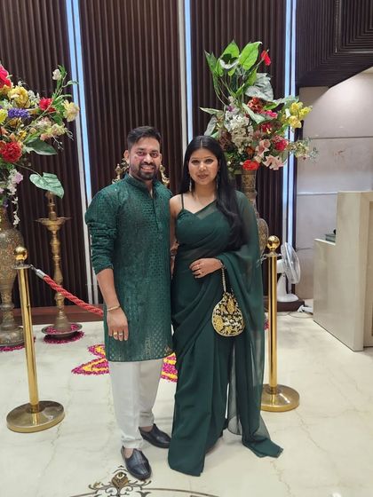 A full-length shot with our clients after a successful event. We are dressed in coordinated green, celebrating the end of another great project.